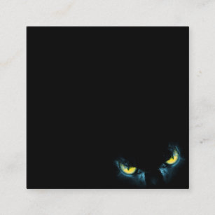 Scary cat eyes on a black background square business card