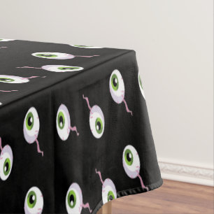 Scary eyeballs on black tablecloth