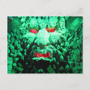 Scary Masked Face in Rock Face Postcard