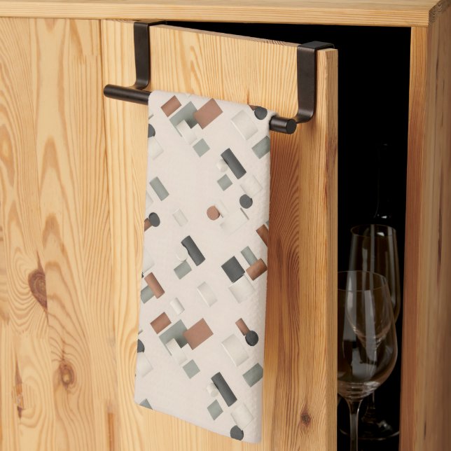 Scattered coloured 3D geometric blocks on a light Tea Towel (Thirds Fold)
