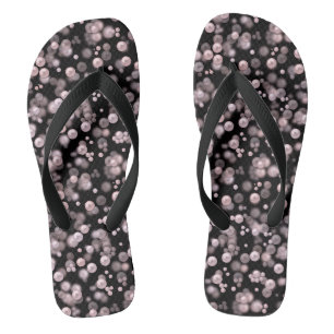 Scatterings of pink and white pearls on black velv thongs