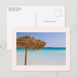 Scenic Tropical Beach with Straw Umbrella Postcard