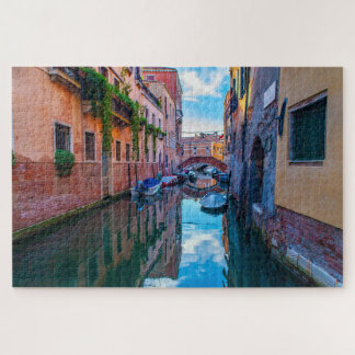 Scenic viewof a canal with boats in Venice, Italy Jigsaw Puzzle