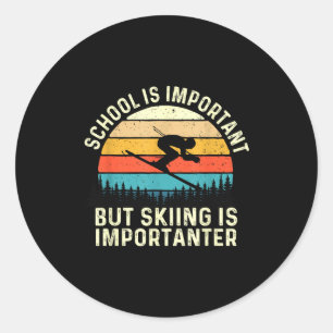 School is important but skiing is importanter - classic round sticker