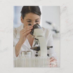 Scientist using microscope in pharmaceutical postcard