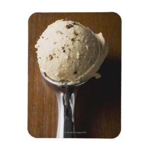 Scoop of ice cream in ice cream scoop (overhead magnet