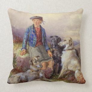 Scottish boy with wolfhounds in a Highland landsca Cushion