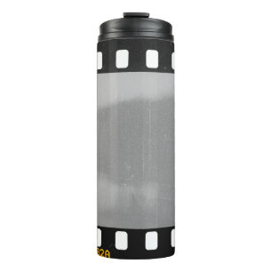 Scratched film strip, vintage placeholder. thermal tumbler