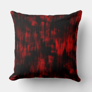 Scratched spots in bright red and black cushion