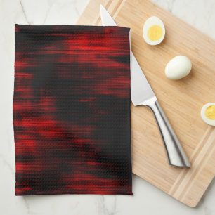 Scratched spots in bright red and black tea towel