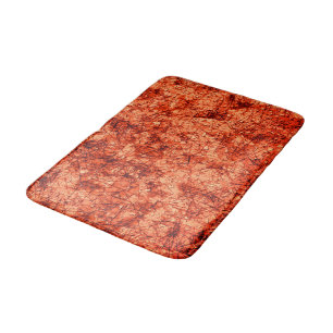 Scratches on a lightly spotted coral background bath mat