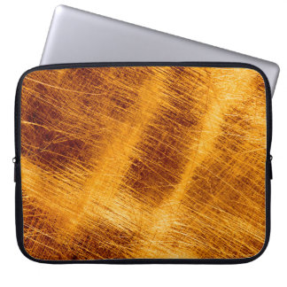 Scratches on a metallic gold background. abstract, laptop sleeve