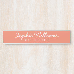 Script Bold White Fonts Name Title on Salmon Pink Door Sign