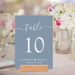 Script Dusty Blue Wedding Reception Table Number<br><div class="desc">Chic dusty blue wedding reception 5X7 table numbers with giclee photo cards and wood holders. These signs feature "table" in a stylish white calligraphy script with swashes, the table number in elegant white serif typography, your first names joined by a heart and your reception date. Create each table number sign...</div>