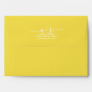 Script initials illuminating yellow wedding envelope