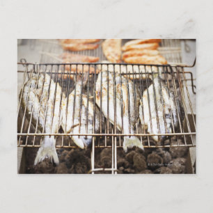 Sea breams on barbecue grill. postcard