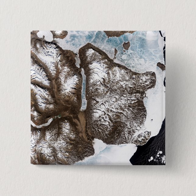Sea ice lines the shoreline in eastern Greenlan 15 Cm Square Badge (Front)
