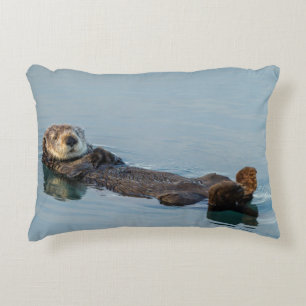 Sea otter floating on back in ocean decorative cushion