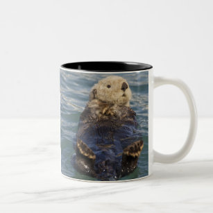 Sea otters play on icebergs at Surprise Inlet Two-Tone Coffee Mug