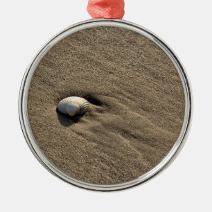 Sea shell at the beach metal ornament