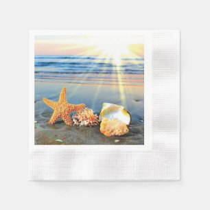 Sea shells and starfish on beach napkin