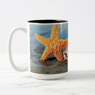 Sea shells and starfish on beach Two-Tone coffee mug