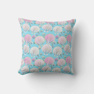 Sea shells on a turquoise blue background cushion