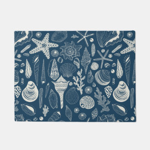 Sea shells on dark blue doormat