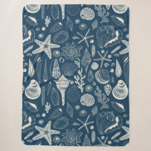 Sea shells on dark blue sherpa blanket