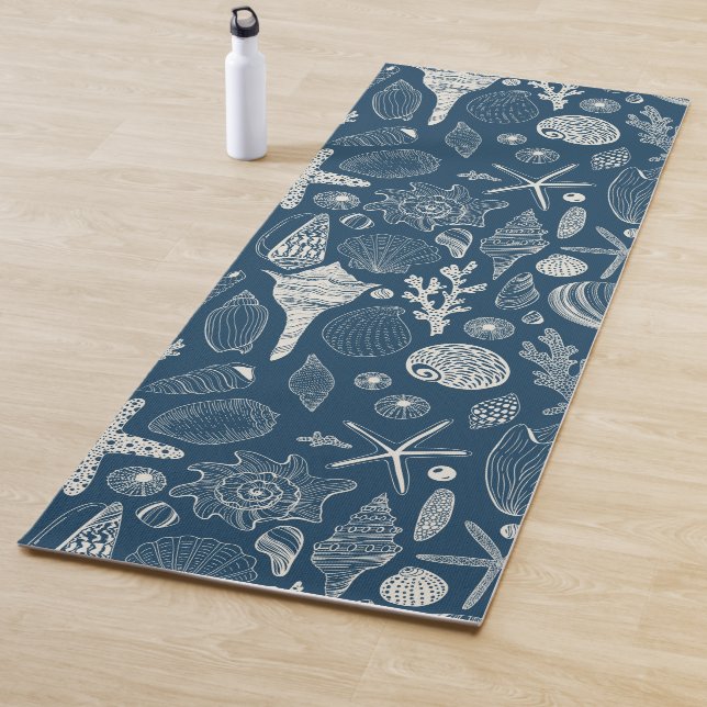 Sea shells on  dark blue yoga mat (In Situ)