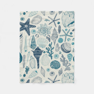 Sea shells on off white fleece blanket