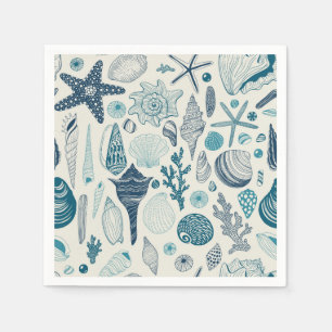 Sea shells on  off white napkin