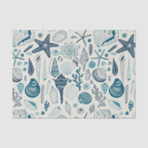 Sea shells on off white tissue paper