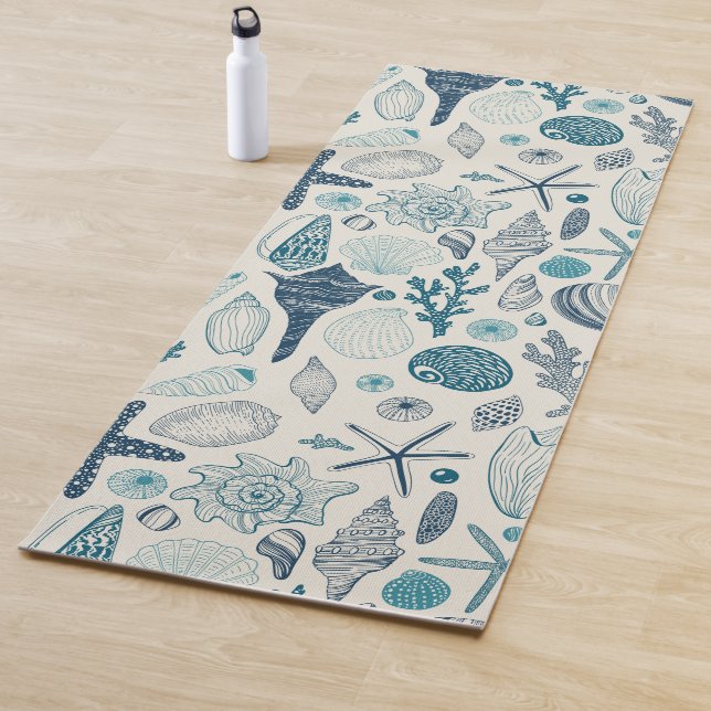Sea shells on  off white yoga mat (In Situ)