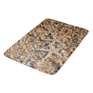 Sea shells on the shore bath mat