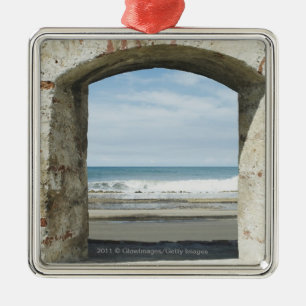 Sea viewed from an archway metal tree decoration