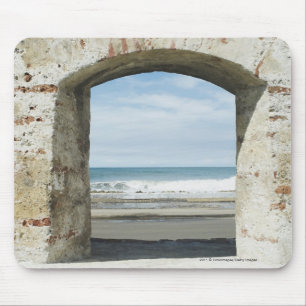 Sea viewed from an archway mouse pad