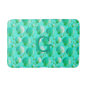 Seafoam green seashells on aqua bath mat