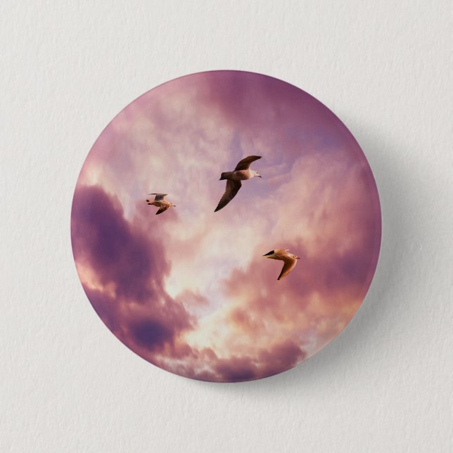 Seagulls flying in a sunset sky 6 cm round badge (Front)