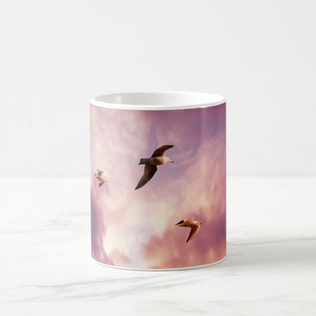 Seagulls flying in a sunset sky coffee mug (Center)