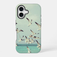 Seagulls Flying Over Ocean