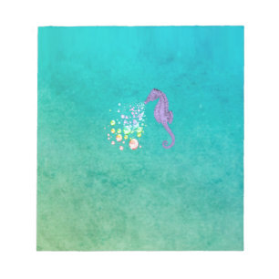 Seahorse blowing rainbow bubbles in the water notepad