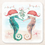 Seahorse Santa Coastal Christmas Kiss Beach  Square Paper Coaster<br><div class="desc">Coastal theme Christmas drink coasters feature a watercolor seahorse couple on the beach wearing Santa hats and kissing under mistletoe. Visit my "Seahorse Coastal Christmas Kiss" collection for coordinating invitations,  cards,  party supplies,  decor and more. Art by KL Stock.</div>