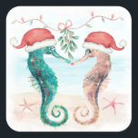 Seahorse Santa Coastal Christmas Kiss Beach  Square Sticker<br><div class="desc">Coastal theme Christmas stickers (or envelope seals or gift tags) feature a watercolor seahorse couple on the beach wearing Santa hats and kissing under mistletoe. Visit my "Seahorse Coastal Christmas Kiss" collection for coordinating invitations,  party supplies,  decor and more. Art by KL Stock.</div>