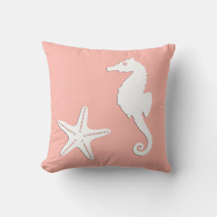 Seahorse & starfish - white on coral pink cushion