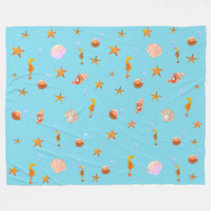 Seahorses, shells & sea stars on turquoise fleece blanket