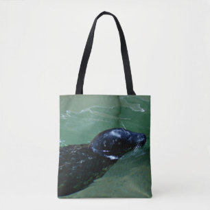 Seal Gliding Through Calm Water Tote Bag