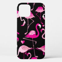 Seamless pattern from pink flamingos on a dark bac