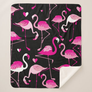 Seamless pattern from pink flamingos on a dark bac sherpa blanket