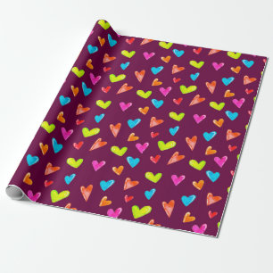 Seamless pattern of multicolored hearts on a purpl wrapping paper